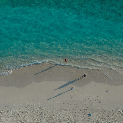 Ariel shot: White sand, blue sky and sea, Maldives.