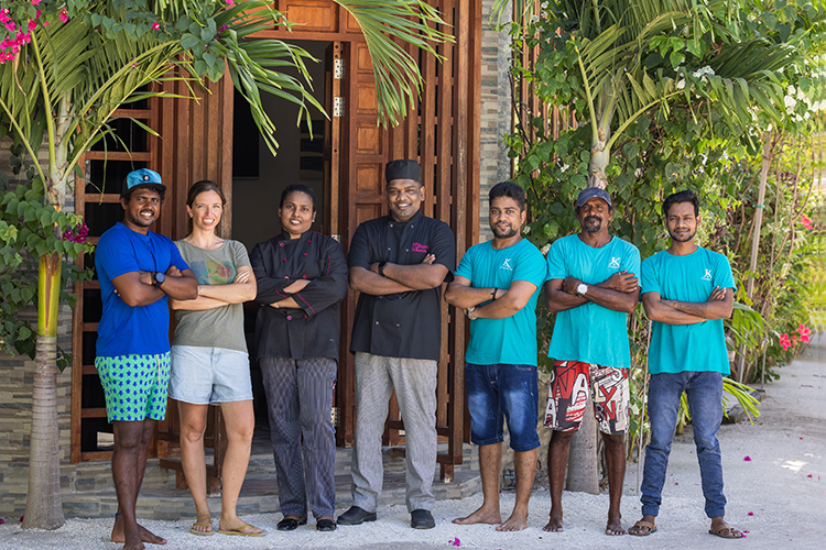 The whole team at the Kamadhoo Inn guesthouse, Maldives